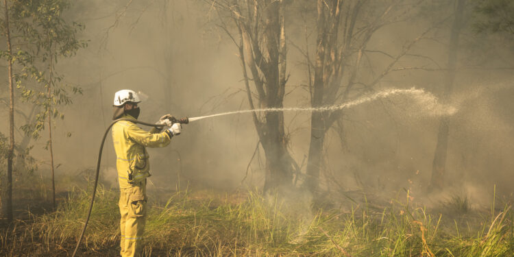 Image of RCC officer with fire hose